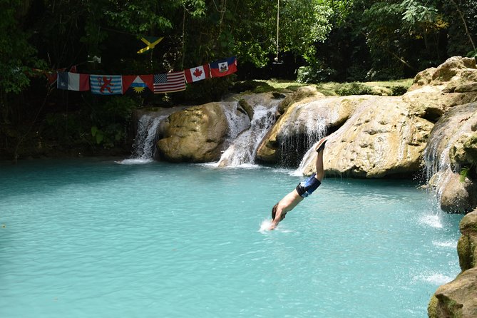 Blue Hole & Secret Falls Day Trip plus Shopping from Runaway Bay - Cool Blue Hole: 30 minutes of rope swings, jumps, and cold fresh water