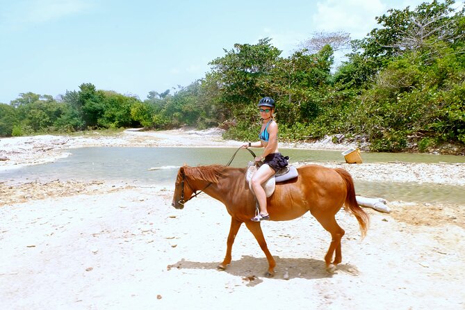 Horseback Ride ATV and Bamboo Rafting Tour Ocho Rios in Jamaica - Stop 2: White River Bamboo Rafting, Rapids, and a Splash-Swim Moment