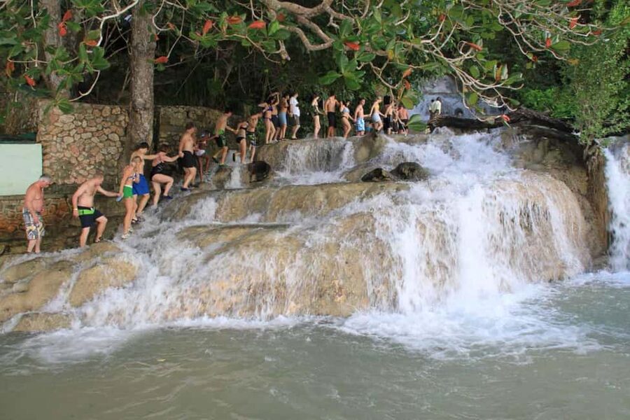 Ocho Rios: Dunn’s River Falls & Reggae Hill Tour - Reggae Hill on the White River: Swimming, Chairs, and Reggae Vibes